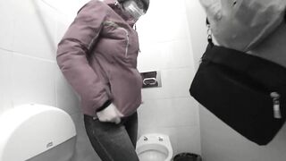 Pissing in a public toilet mature milf.