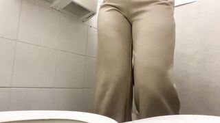 Girl Peeing at the work public toilet