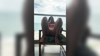 Touching my rich pussy in a hotel room with a view of the beach