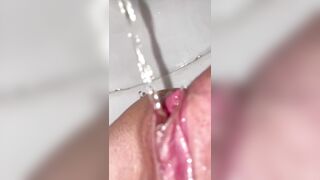She decided to pee instead of sex. Pussy closeup view.