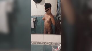 18 years old dyke posing in front of bathroom mirror