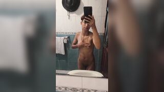 18 years old dyke posing in front of bathroom mirror