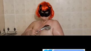 Ugly fat granny with mask takes a shower. Her saggy titts are amazing.